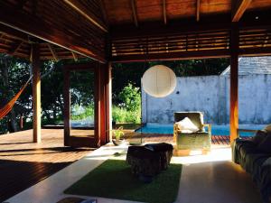 a living room with a couch and a table at Kooyu Villas in Port Vila