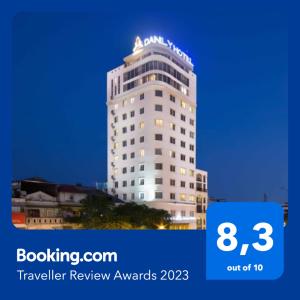 a tall white building with the words travel review awards at Danly Hotel in Hanoi