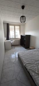 Posteľ alebo postele v izbe v ubytovaní Colocation maison - Villeurbanne près de Lyon