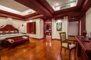 Ένα ή περισσότερα κρεβάτια σε δωμάτιο στο THE PRIVILEGE FLOOR by Borei Angkor