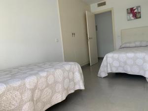 Łóżko lub łóżka w pokoju w obiekcie Casa Grullo