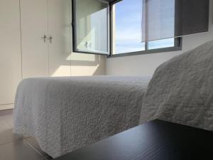Łóżko lub łóżka w pokoju w obiekcie Casa Grullo