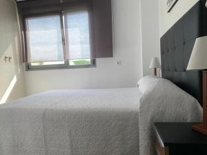 Łóżko lub łóżka w pokoju w obiekcie Casa Grullo