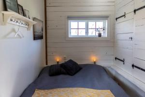 Rúm í herbergi á Eksgården