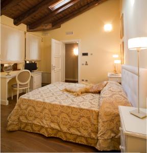 En eller flere senge i et værelse på Wine Resort Luisa