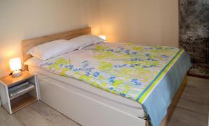 Katil atau katil-katil dalam bilik di Apartment Colibri