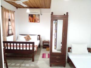 Postel nebo postele na pokoji v ubytování Muduna Walawwa Resort