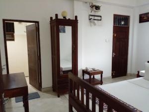 Postel nebo postele na pokoji v ubytování Muduna Walawwa Resort