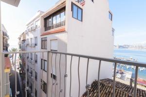 a balcony of a building with a view of the ocean at Clopy Mirador del Castillo in Benidorm