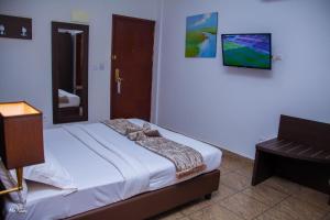 Postel nebo postele na pokoji v ubytování New Heaven Hôtel