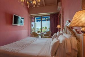 Кровать или кровати в номере Olivi Hotel & Natural Spa