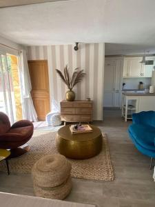 a living room with a couch and a coffee table at Sublime Maison Proche Mer Avec Piscine in Sanary-sur-Mer