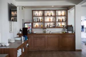 a room with a counter with bottles on shelves at Aranya Boutique Hotel in Kathmandu