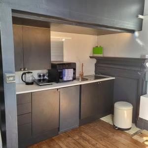a kitchen with a sink and a counter top at 21 Mini Loft Apartment - Great Location - Comfy King Size Bed in Brighton & Hove