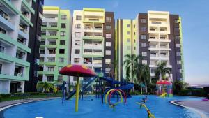 a swimming pool with a slide and a water park at HOMESTAY COMFY CONDO with Waterpark, Pool, Playground & Gym in Ipoh +29 photos