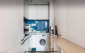 a kitchen with a washing machine and a washer at Urban Exit Studio Gangnam in Seoul