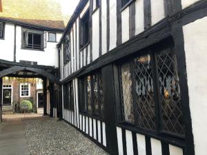 an old black and white building with an alley at The Old Laundry in Rye
