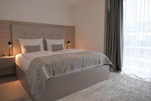 Ένα ή περισσότερα κρεβάτια σε δωμάτιο στο Aparthotel Cosy
