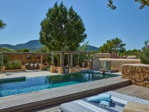 a swimming pool in the middle of a yard at Kasbah 1 in Cala Vadella