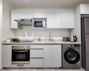 A kitchen or kitchenette at Selena Bay Resort - Luxury 2 Bed Apt with Private Beach