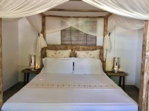 Voodi või voodid majutusasutuse Samura Maldives Guest House Thulusdhoo toas