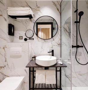 a bathroom with a sink and a mirror at Star Champs-Elysées in Paris +116 photos