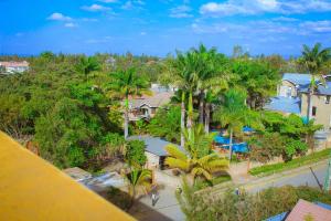 an aerial view of a resort with a pool and trees at Lux Suites L&N Apartments Utawala in Embakasi