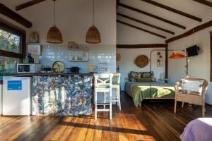 a kitchen and a bedroom with a bed in a room at Vale da Silva Villas - Homes in Albergaria-a-Velha