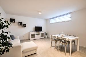 TV a/nebo společenská místnost v ubytování Corallo House Alghero + 1 fotografie