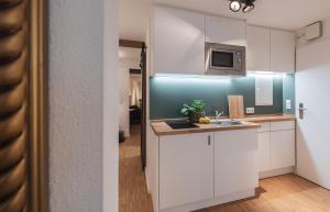 Kuchyň nebo kuchyňský kout v ubytování St. Salvator Apartments