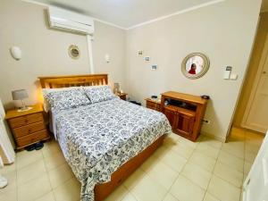 En eller flere senge i et værelse på El Relax del Puerto