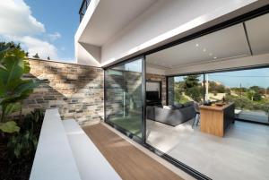 A balcony or terrace at Villa Kallos by PosarelliVillas