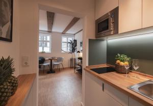 Kuchyň nebo kuchyňský kout v ubytování St. Salvator Apartments