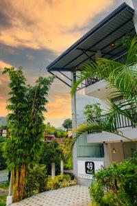 a building with a clock on the side of it at 49 Ella in Ella