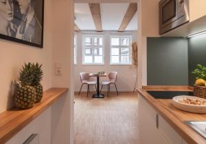 Kuchyň nebo kuchyňský kout v ubytování St. Salvator Apartments