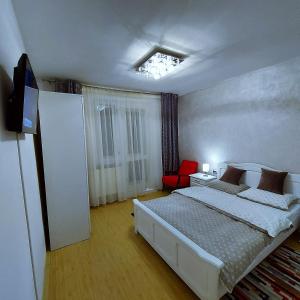 Gulta vai gultas numurā naktsmītnē Apartament Panoramic Toplița