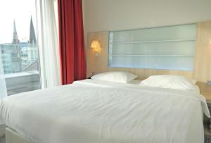 Krevet ili kreveti u jedinici u okviru objekta Park Inn by Radisson Linz
