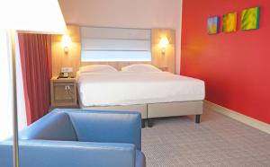 Krevet ili kreveti u jedinici u okviru objekta Park Inn by Radisson Linz