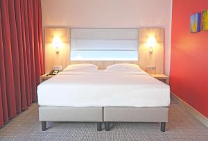 Krevet ili kreveti u jedinici u okviru objekta Park Inn by Radisson Linz