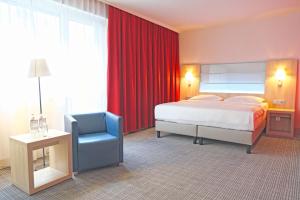 Krevet ili kreveti u jedinici u okviru objekta Park Inn by Radisson Linz