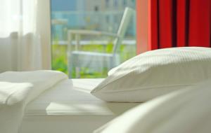 Krevet ili kreveti u jedinici u okviru objekta Park Inn by Radisson Linz