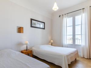 Katil atau katil-katil dalam bilik di Apartment Foncillon by Interhome