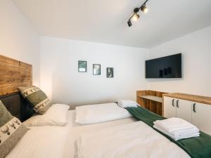 Posteľ alebo postele v izbe v ubytovaní Chalet Mountain Lodge - Klippitztörl by Interhome