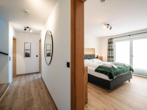 Posteľ alebo postele v izbe v ubytovaní Chalet Mountain Lodge - Klippitztörl by Interhome
