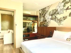 Postel nebo postele na pokoji v ubytování The Henry Hotel Roost Bacolod