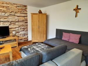A television and/or entertainment centre at Apartment Kogler