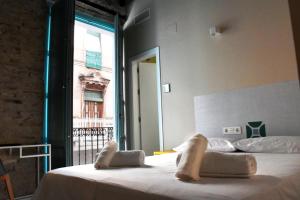 Krevet ili kreveti u jedinici u okviru objekta Alegoría Coliving Experience Residencia