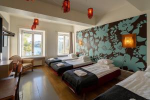 Postel nebo postele na pokoji v ubytování Reimersholme Hotel + 37 fotografií