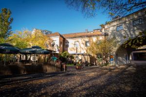 an empty street with umbrellas and a building at Reimersholme Hotel in Stockholm