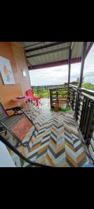 uma vista para uma varanda com um piso geométrico em shelos Happy Place by the View em Dávao